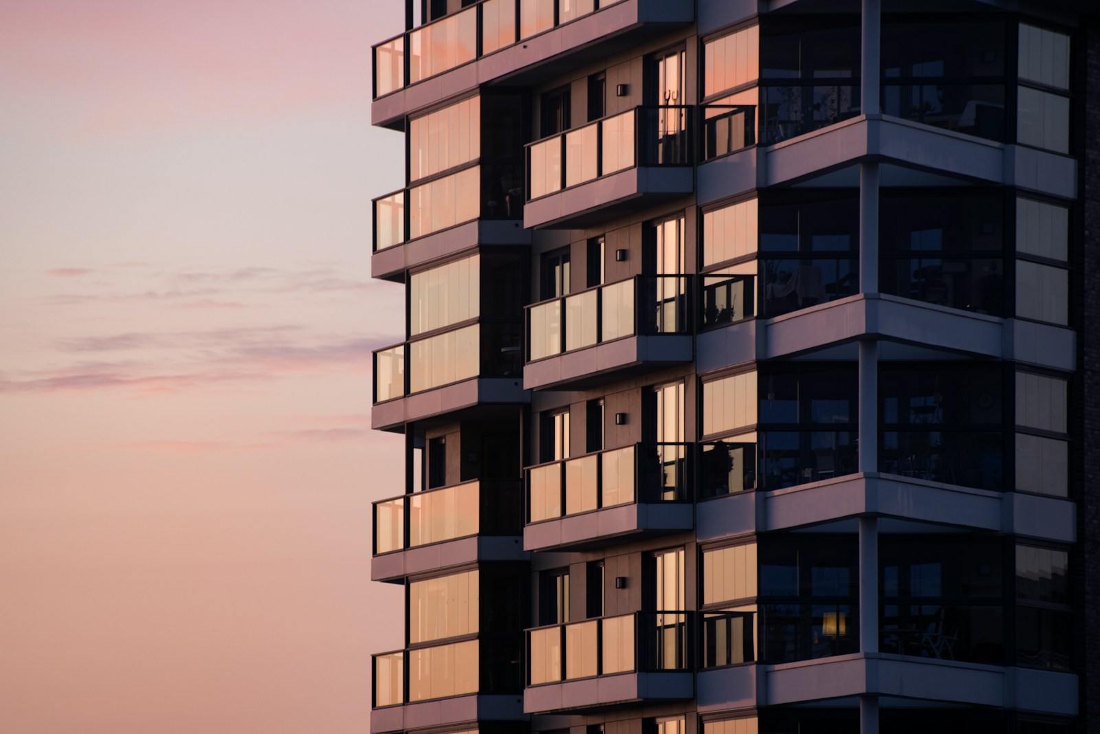 Contemporary residential tower with a white façade.